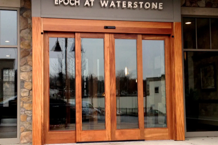 Custom wood-framed automatic slide door entrance